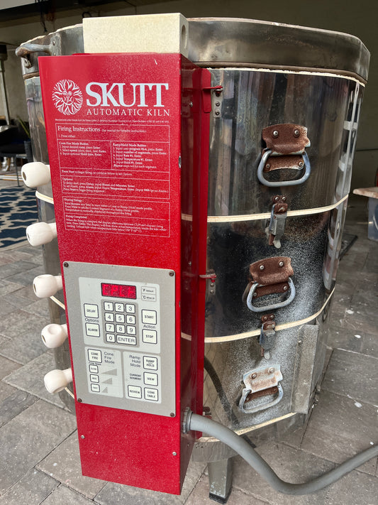 Metal kiln used for firing pottery.