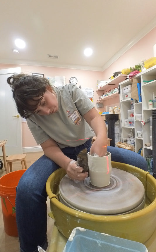 Woman making handmade pottery.