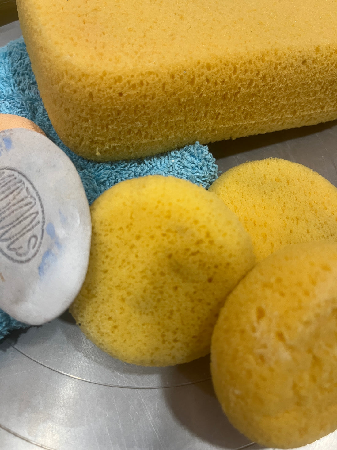 Yellow sponges for making handmade pottery.