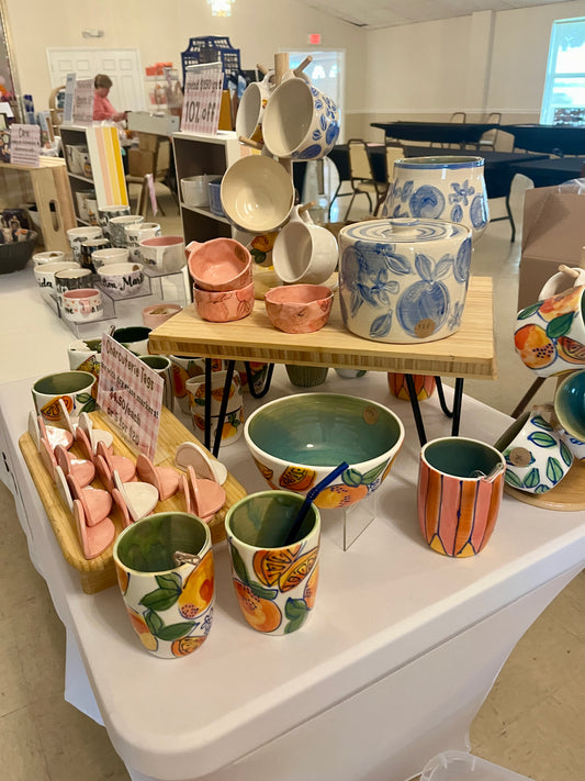 Handmade pottery items displayed for sale.