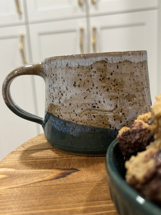 Brown and dark green handmade pottery mug.